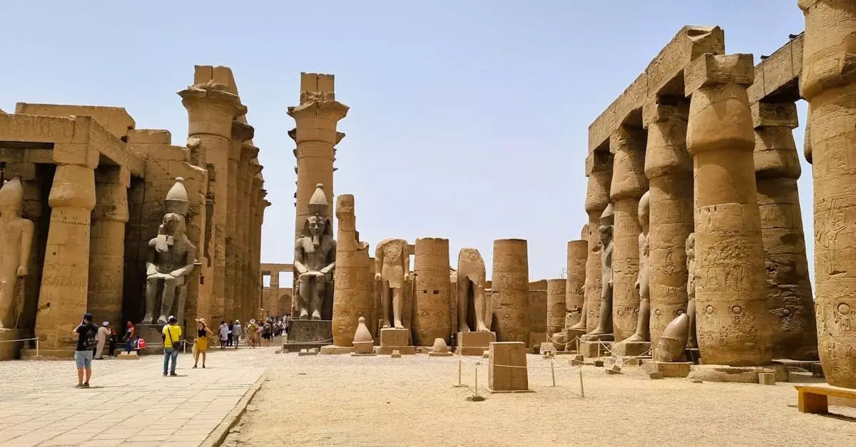 Explore the ancient columns and statues of Luxor Temple, a historic landmark in Egypt.