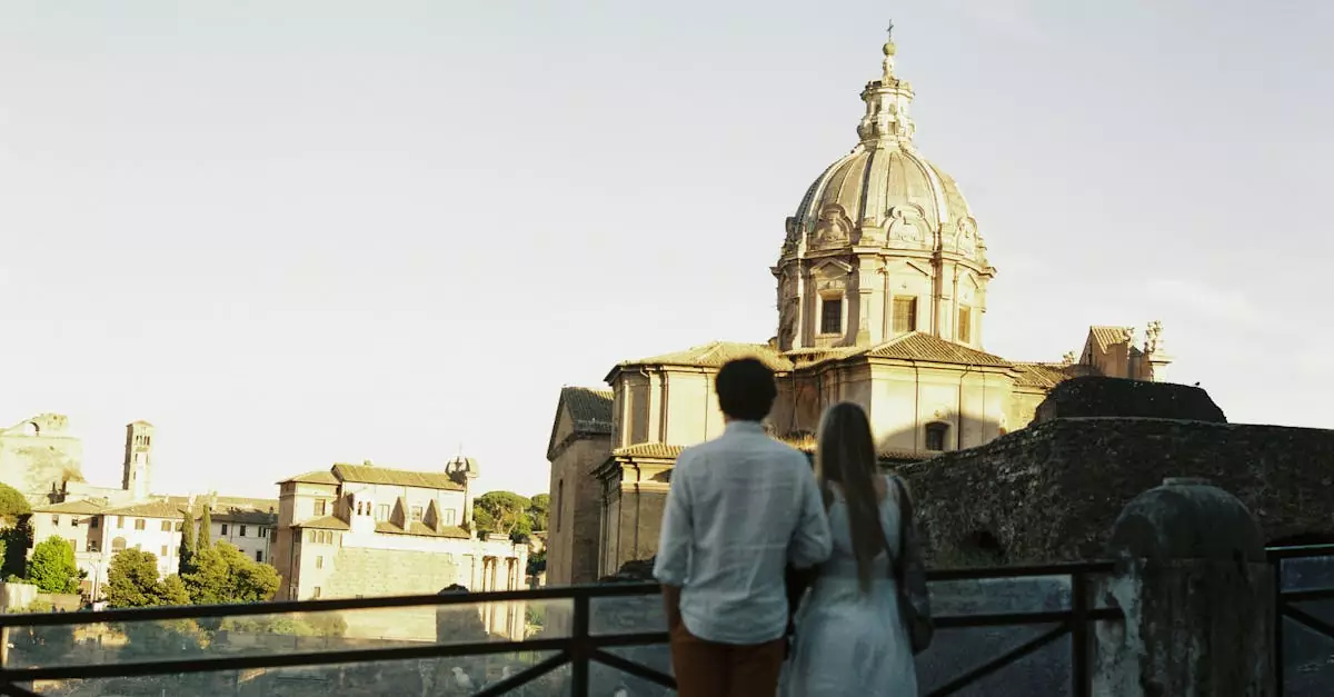 A couple enjoys a sunset view of classic Roman architecture in Rome, Italy.