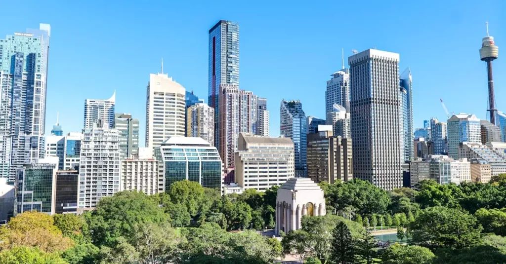 Best Australia Adrenaline Experiences for Thrill-Seekers 4 Panoramic view of Sydney's skyline featuring Hyde Park and the iconic War Memorial.