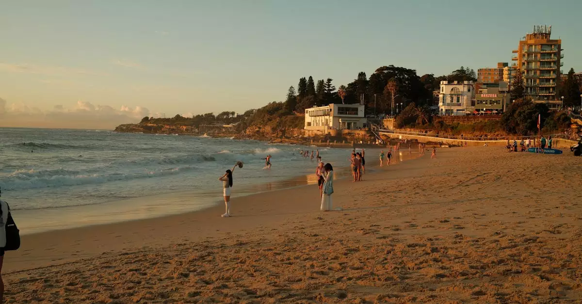 People enjoying a warm evening at Coogee Beach, Sydney during sunset. Relaxing coastal vibe.