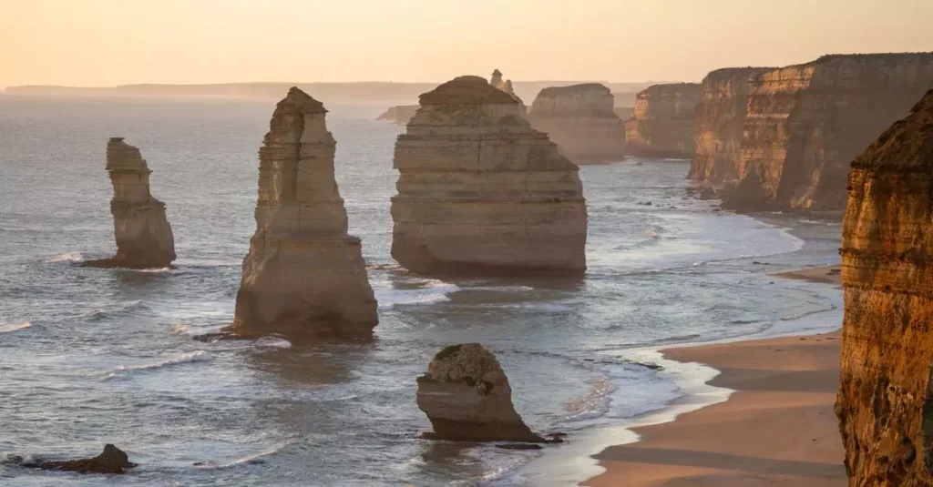 Best Beach Road Trips Australia: Coastal Drives 2 Breathtaking sunset view of the Twelve Apostles along the Great Ocean Road in Victoria, Australia.