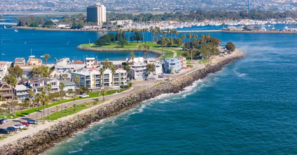 Best Beach Towns in California: Pacific Beach & More 5 Stunning drone shot of San Diego's coastline, showcasing urban cityscape and ocean views.