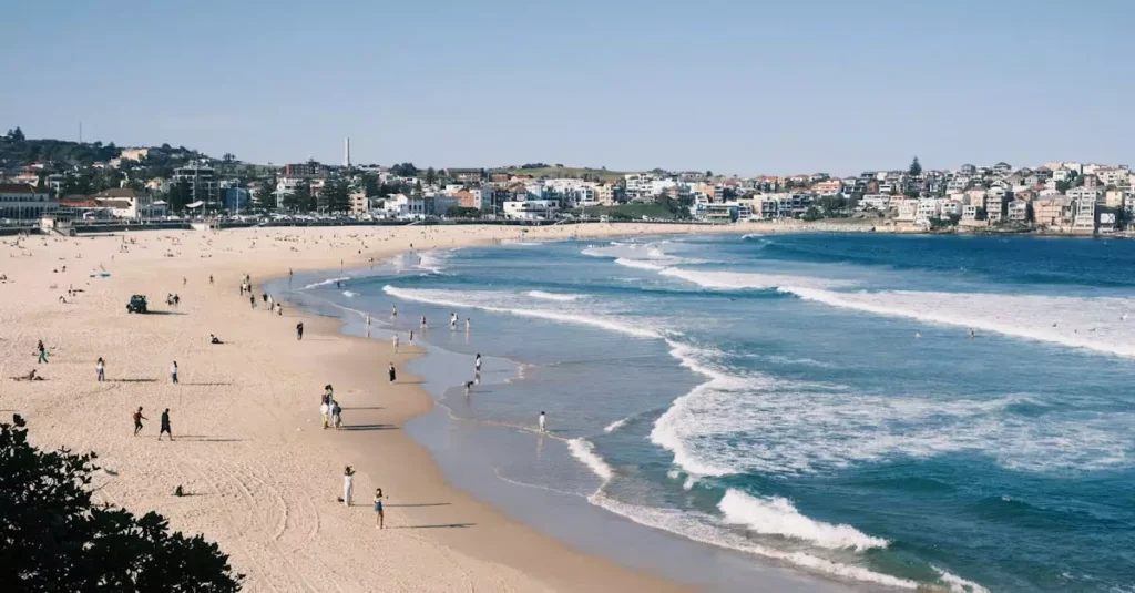 Best Beaches Australia: Your Ultimate Guide 2 A beautiful day at Bondi Beach with waves crashing and people enjoying the sunny weather in Sydney, Australia.