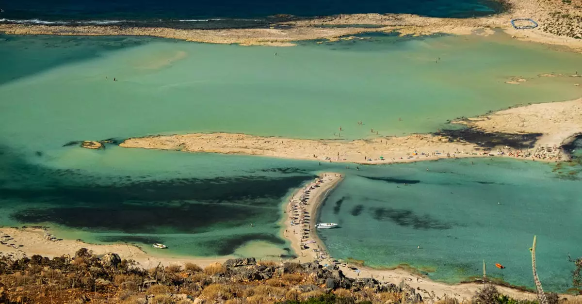 A stunning aerial view of Balos Beach Lagoon, featuring turquoise waters and a sandy shore.