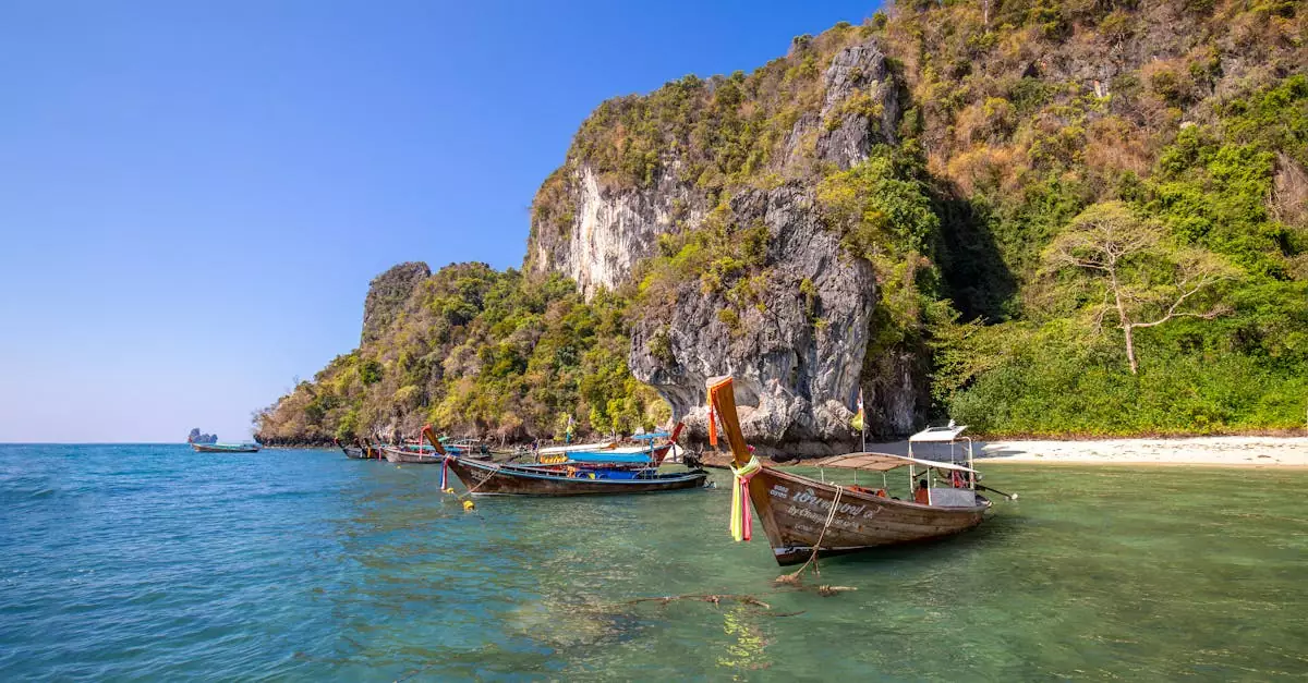 Traditional wooden boats in a turquoise bay with scenic cliffs and clear skies, perfect for travel inspiration.