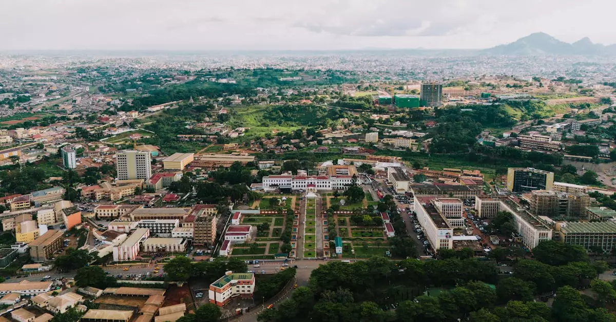 Stunning aerial view of Yaoundé cityscape with green landscapes and urban architecture.
