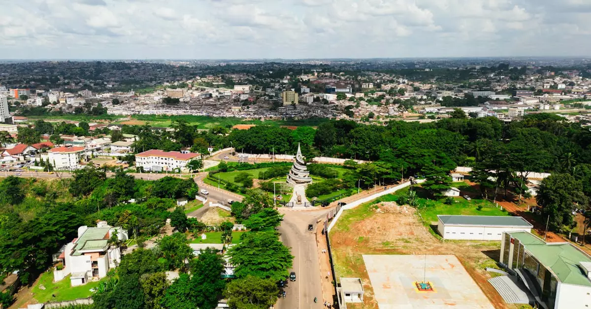 A stunning aerial shot of the Reunification Monument in Yaoundé, Cameroon showcasing urban beauty.