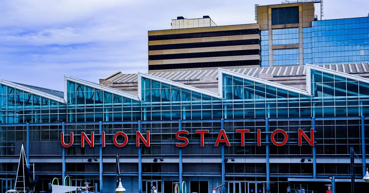 Exterior view of Union Station in Kansas City showcasing modern glass architecture and vibrant cityscape.