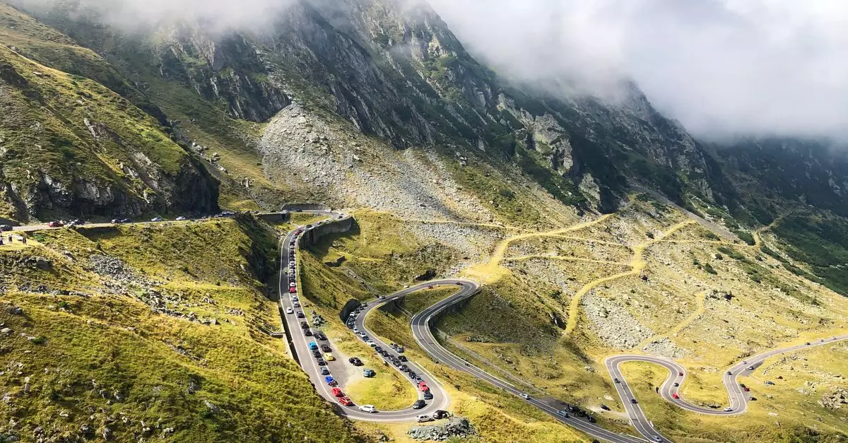 Scenic aerial view of the winding roads of Transfăgărășan in Rom&acirc;nia's Carpathian Mountains.