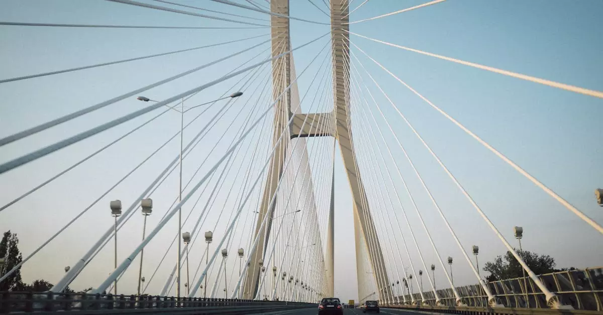 Stunning low angle view of the Redzinski Bridge in Poland with suspension cables during dawn light.