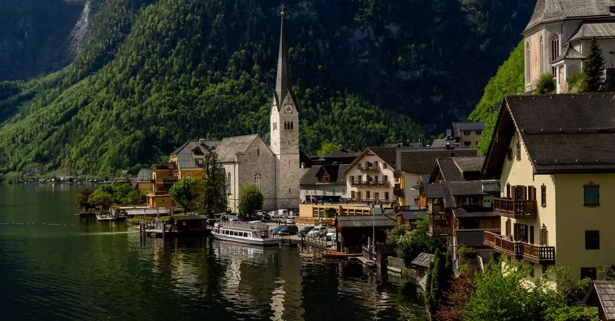 Charming view of Hallstatt with its iconic church by the lake against a backdrop of mountains.
