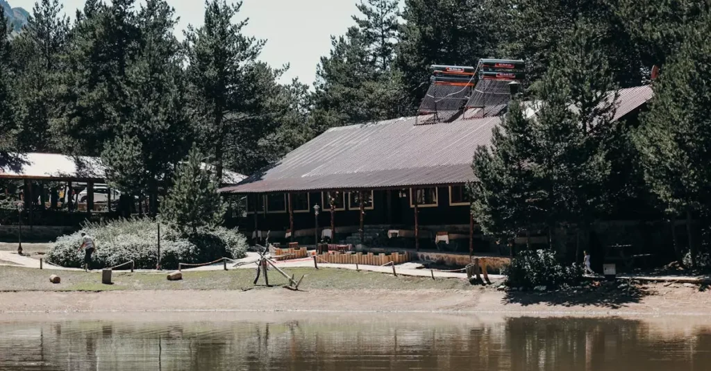 Best Fishing Lodges Worldwide: Top Angling Adventures 2 Charming lodge nestled in a lush forest by a tranquil lake in Gümüşhane, Turkey.