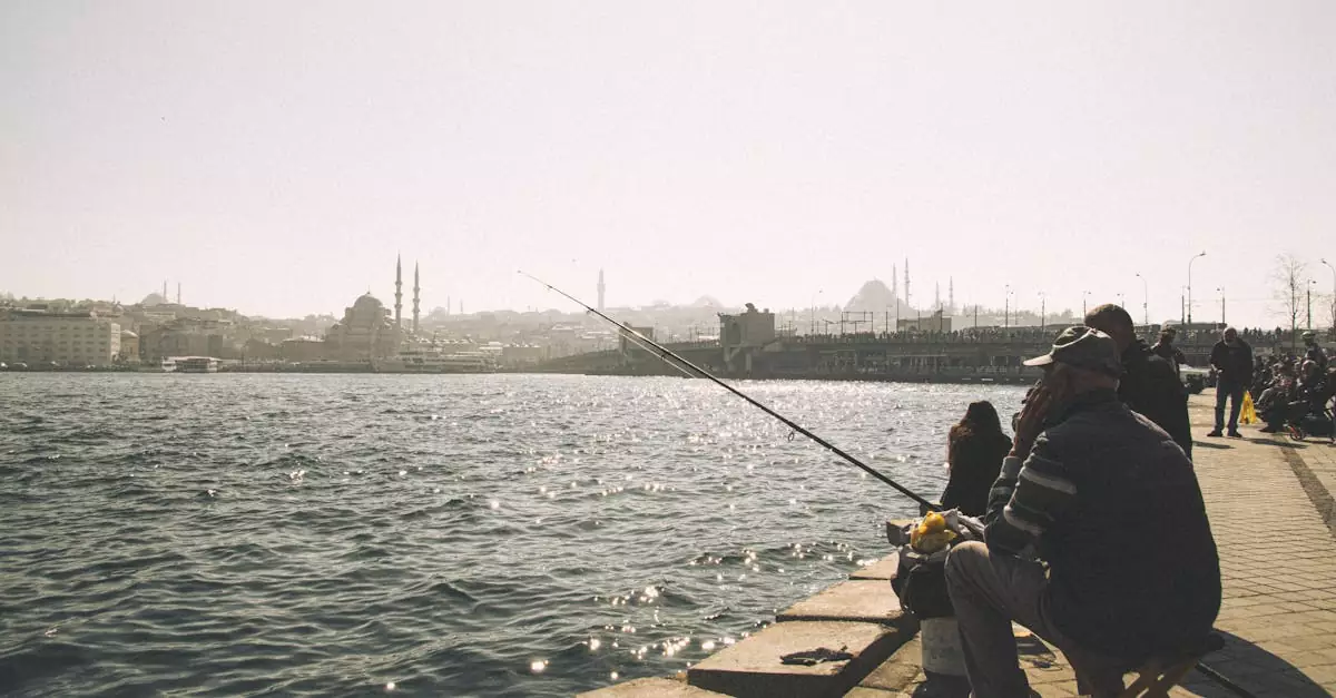 People fishing by the Bosphorus with Istanbul skyline in the background.