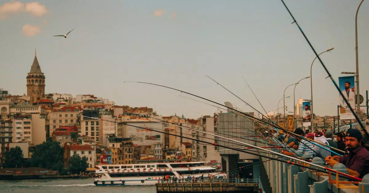 Fishermen with rods on Galata Bridge, Istanbul, with cityscape and Galata Tower view.