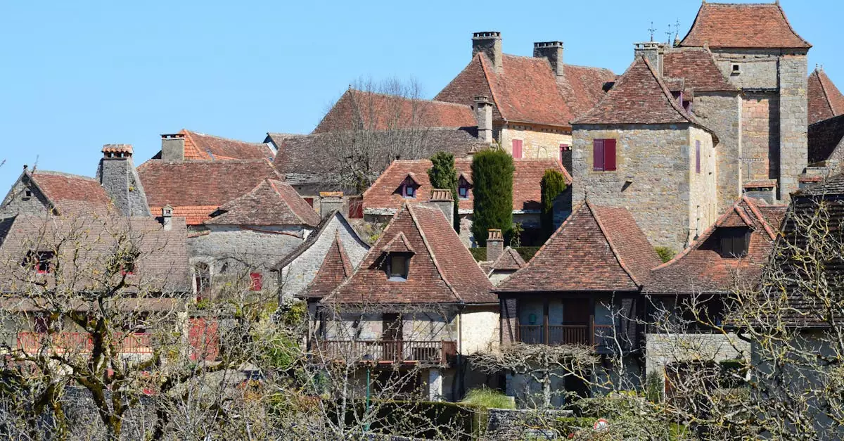 Explore the rustic beauty of a traditional French village with historic stone houses under a blue sky.