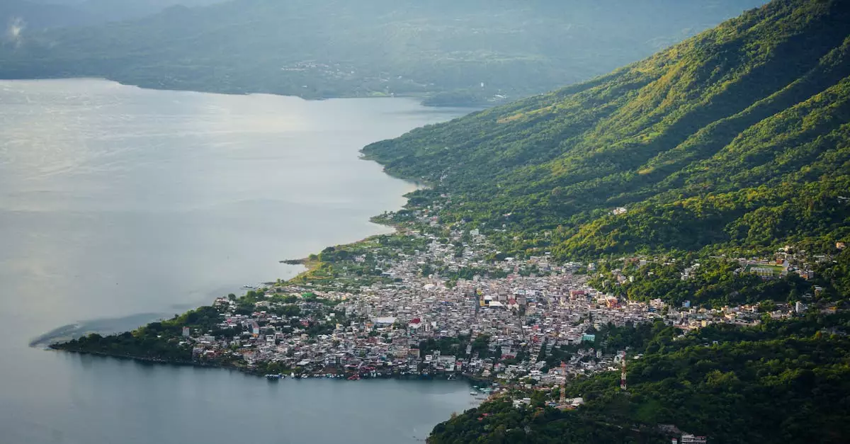 Stunning aerial shot of Lake Atitlán and a nearby town nestled among lush mountains.