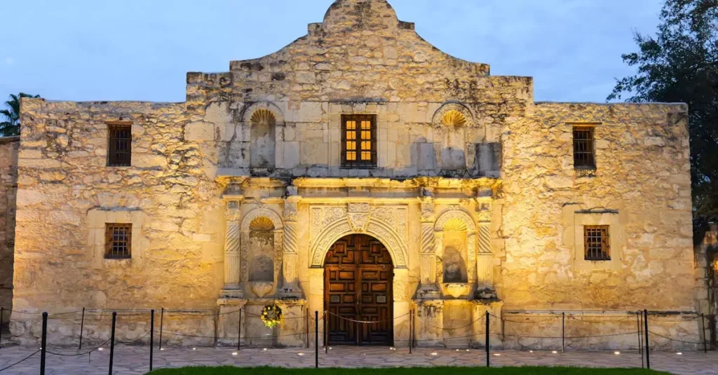 Discover the iconic Alamo Mission's facade beautifully illuminated at dusk in San Antonio, Texas.