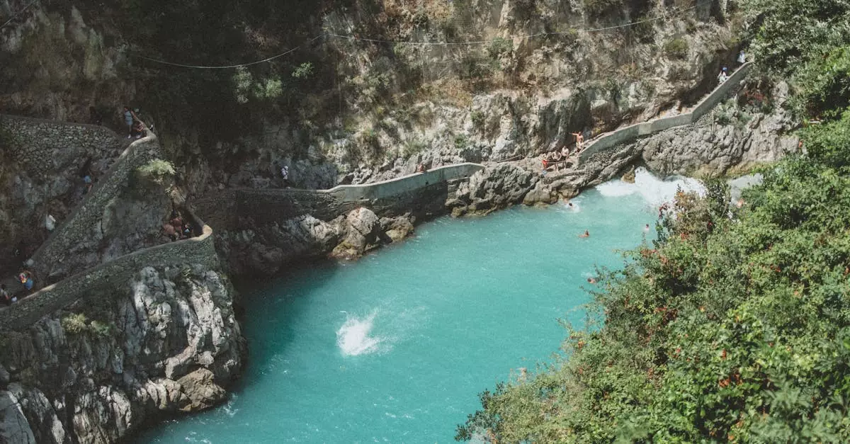 Aerial view of Furore Beach Bay with turquoise waters and rocky cliffs in Italy.