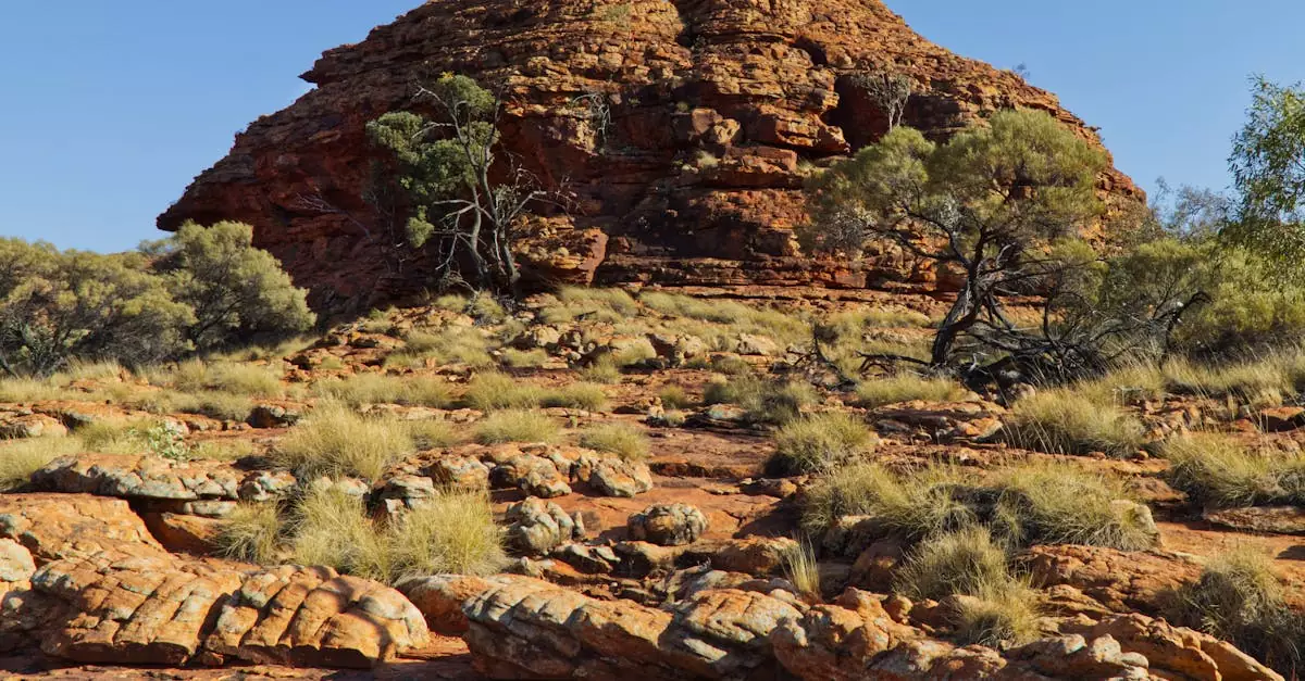 Explore breathtaking red rock formations and rugged desert landscape in Northern Territory, Australia.