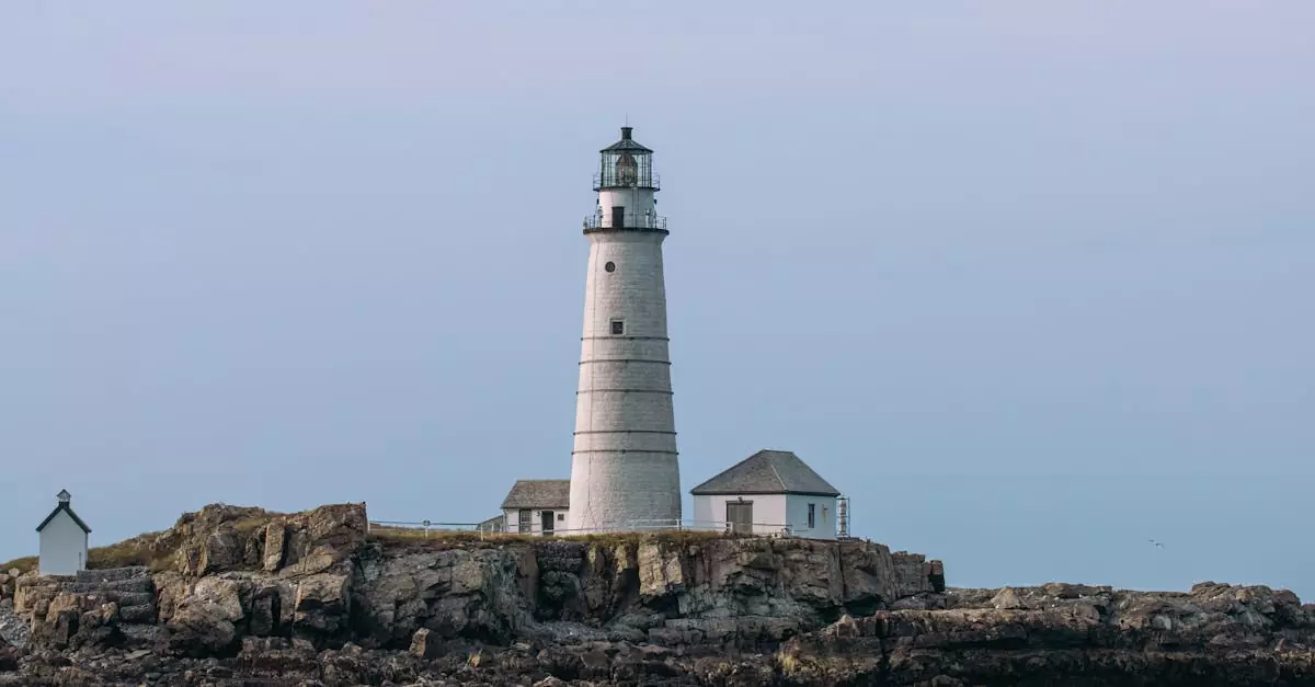 Scenic view of the iconic Boston Light Lighthouse on Little Brewster Island, a historic landmark in Massachusetts.