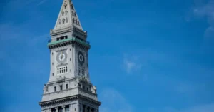 A stunning view of the Custom House Tower in Boston with a bright blue sky.