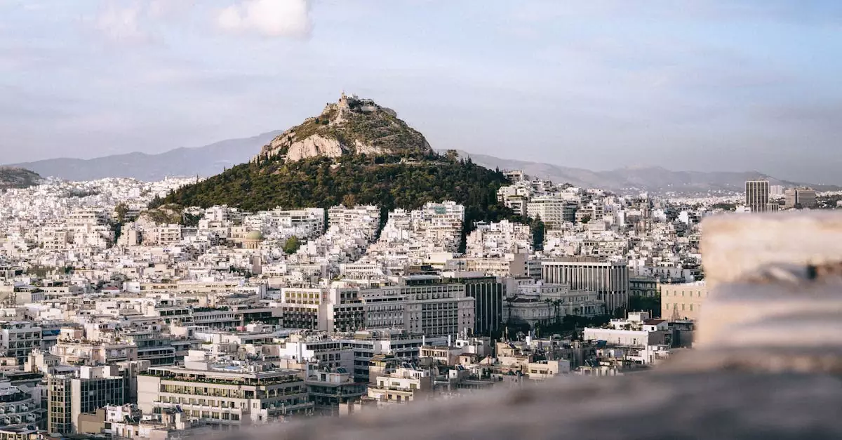 Explore the stunning cityscape of Athens with Mount Lycabettus at its center, captured beautifully in this aerial shot.