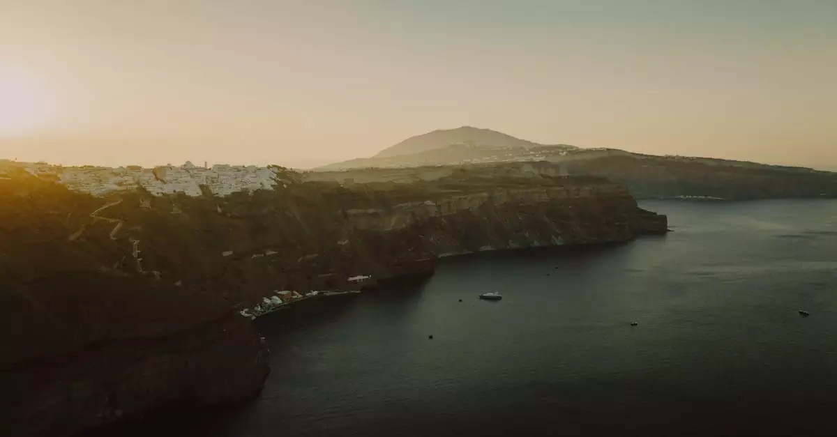 Capture of Thera's dramatic cliffs in Santorini, Greece, at sunset. A tranquil sea view.