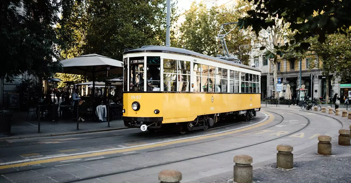 A classic yellow tram navigates a picturesque street in Milan, Italy, surrounded by urban architecture.
