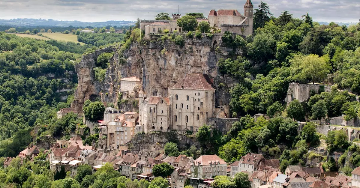 Capture of the historic cliffside village of Rocamadour, nestled in lush greenery.