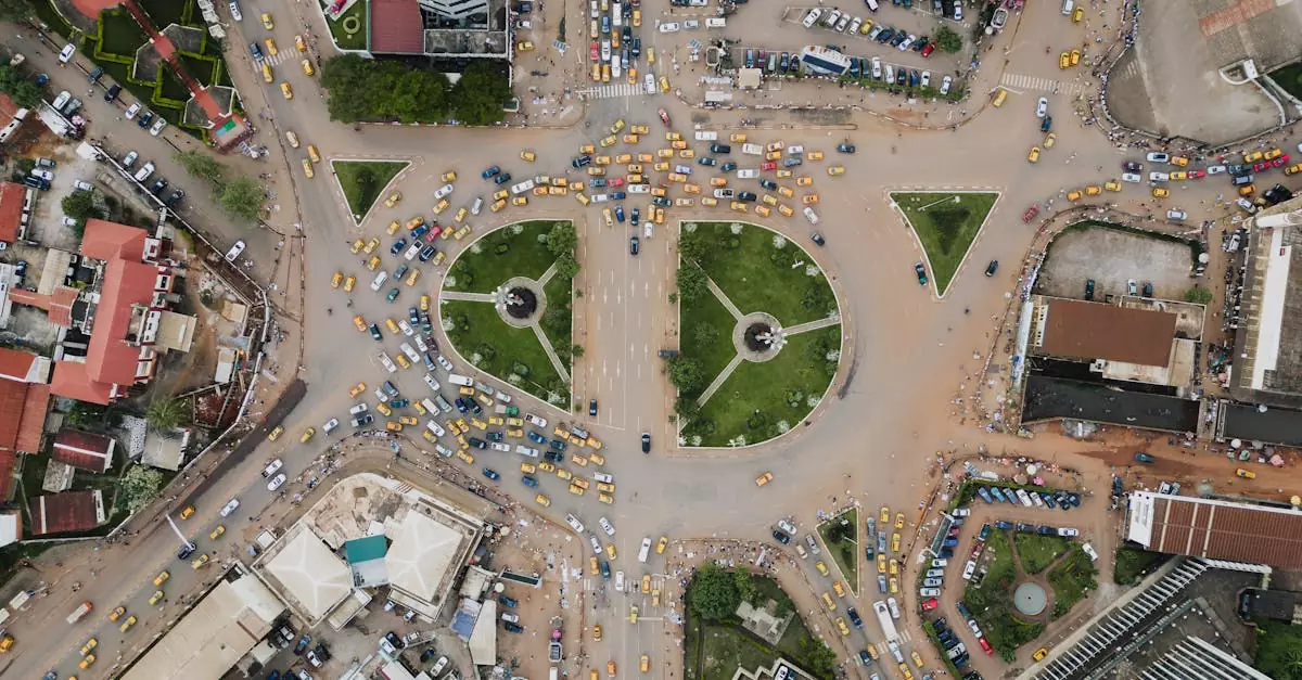A bustling traffic circle in Yaoundé, Cameroon, captured from above showing lively city life.