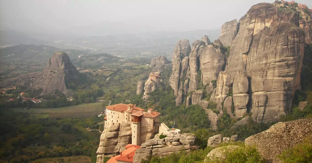 Stunning aerial view of Meteora's ancient monasteries atop rock formations in Greece.