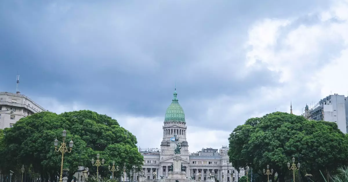 View of the iconic National Congress Building in Buenos Aires with cloudy sky.