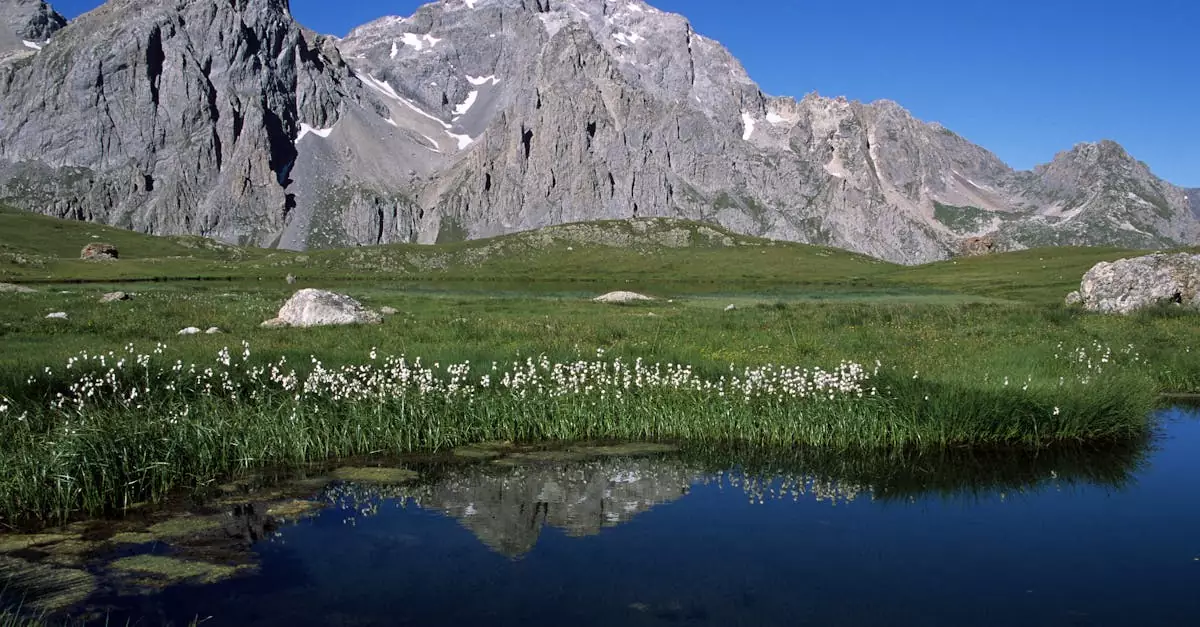 Breathtaking mountain landscape with a serene lake in Le Bourg-d'Oisans, France.