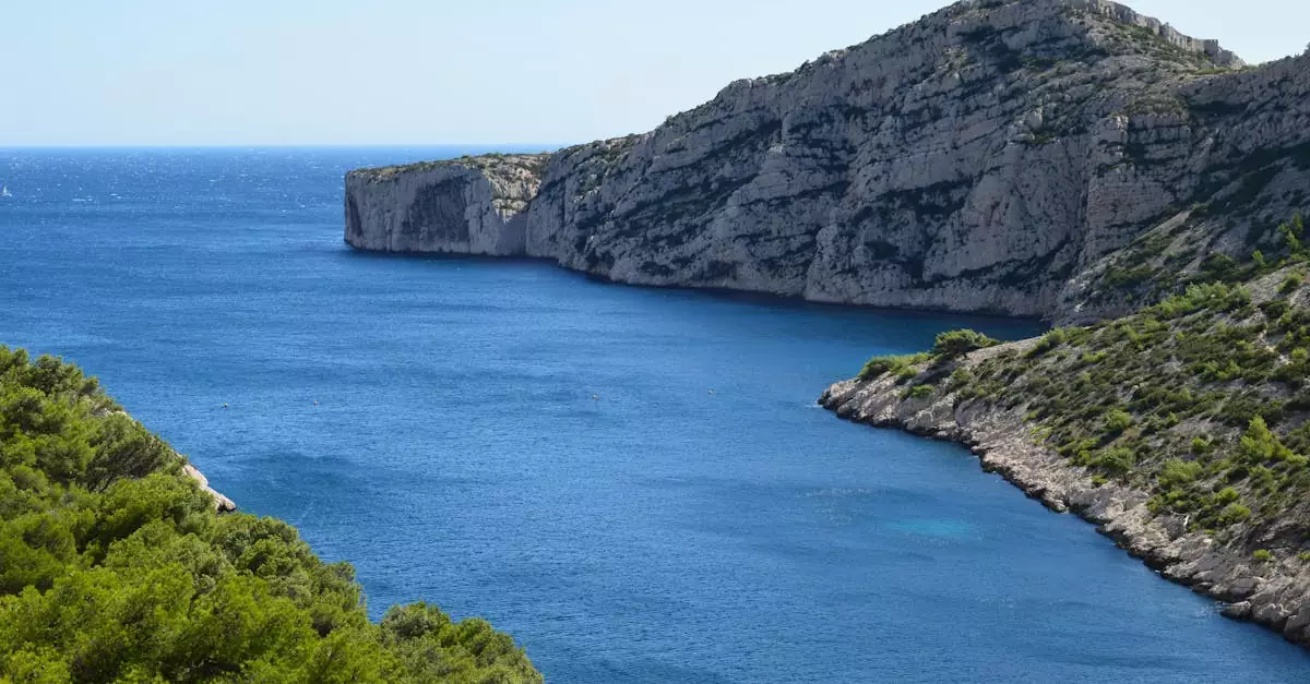 Breathtaking view of Calanques National Park's rugged cliffs and blue sea in Marseille, France.