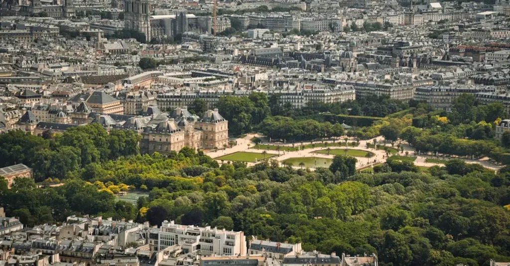 Best National Parks in France: Nature Lover's Guide 2 Stunning aerial view of Luxembourg Gardens amidst Paris cityscape.