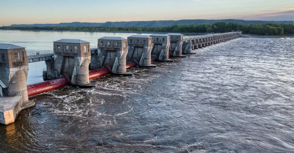 A stunning view of a dam on the Mississippi River in Minnesota under a clear blue sky.