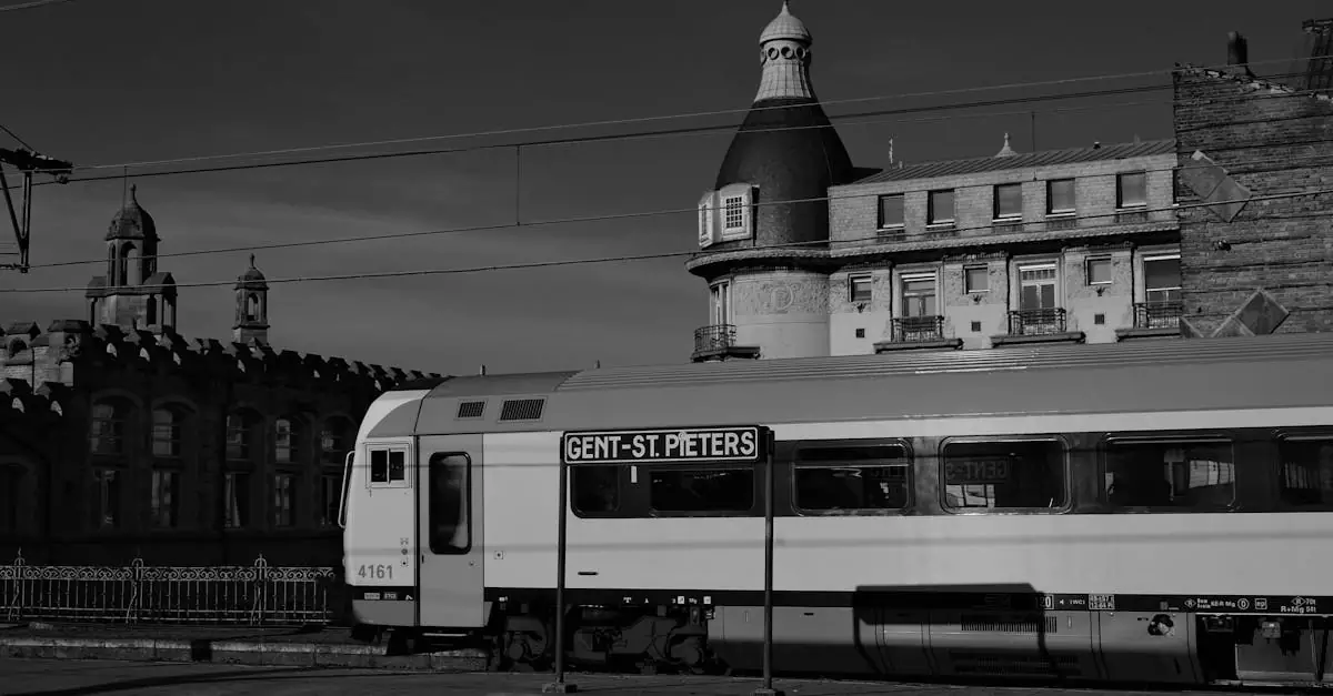 Black and white photo of Gent-St. Pieters train at historic station in Ghent, Belgium.