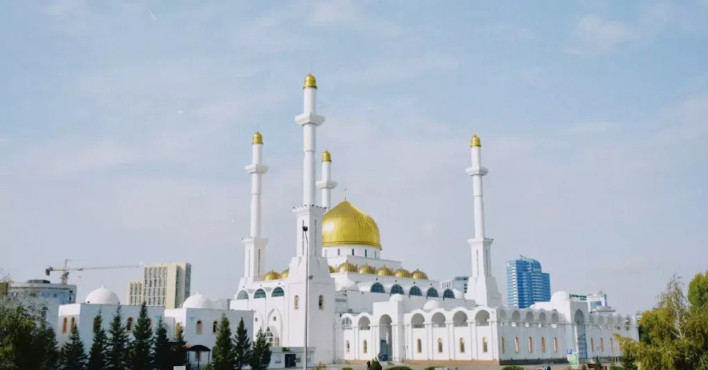 Best Places to Visit in Asia: Your Ultimate Travel Guide 2 The stunning Nur-Astana Mosque in Kazakhstan with its iconic golden domes and minarets against a bright blue sky.