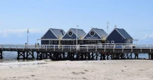 Explore the iconic Busselton Jetty in Western Australia on a sunny day, overlooking the ocean.