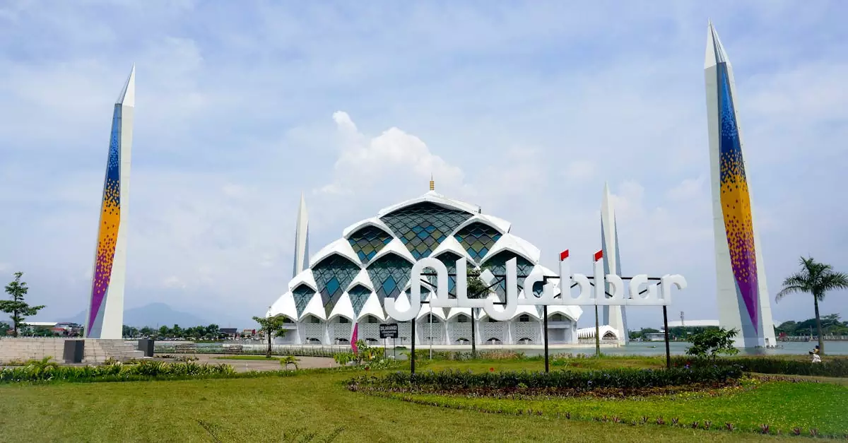Stunning view of Al Jabbar Mosque with colorful minarets and clear blue skies in Bandung, Indonesia.