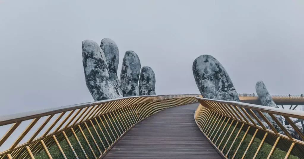 Best Places to Visit in Vietnam: Your Ultimate Guide 2 Golden Bridge with giant stone hands in mist, a landmark in Da Nang, Vietnam.