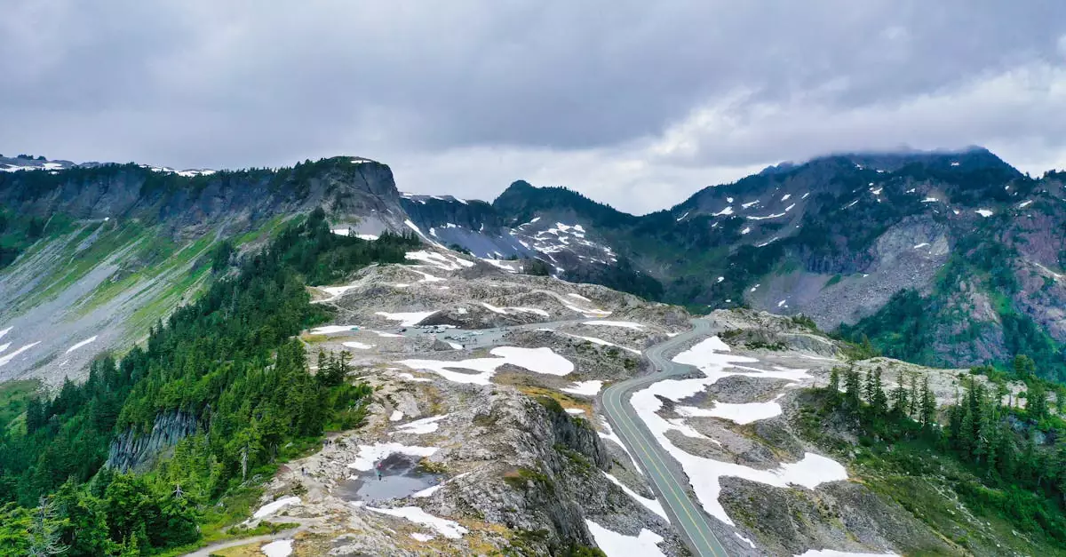 Scenic aerial shot of a winding road in the mountainous landscape of Washington, USA.