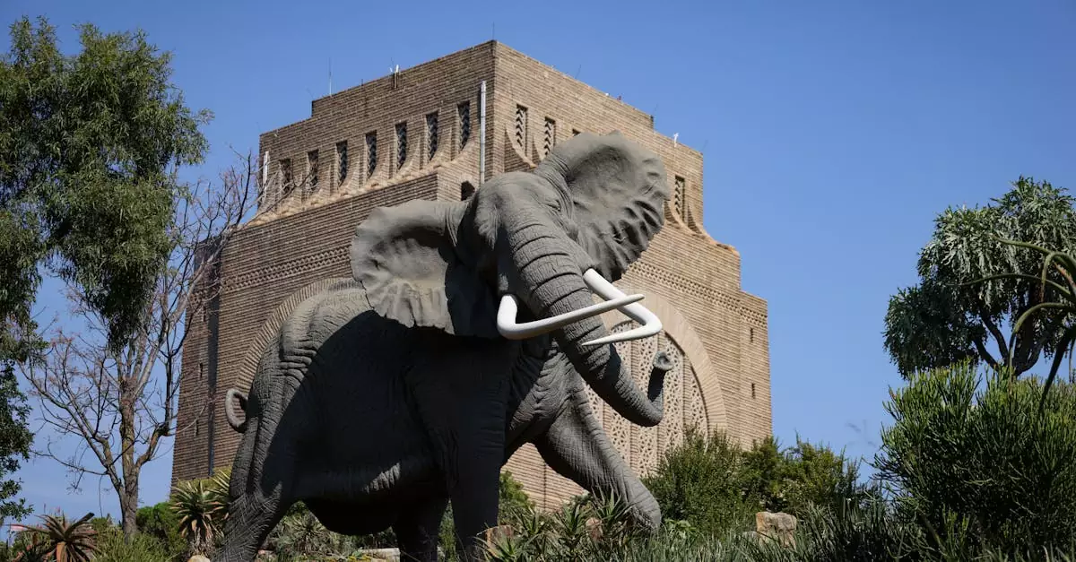 Majestic African elephant statue in front of the Voortrekker Monument in Pretoria, South Africa.