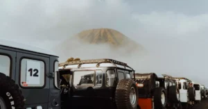 A line of adventure jeeps near the iconic Mount Bromo in East Java, Indonesia.