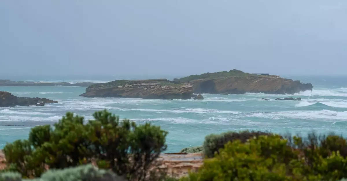 Dramatic cliffs and waves along the iconic Great Ocean Road in Australia, perfect for adventure travel.