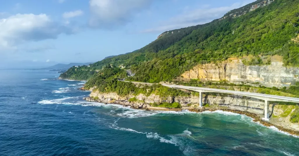 A breathtaking aerial view of Sea Cliff Bridge along the Australian coast.