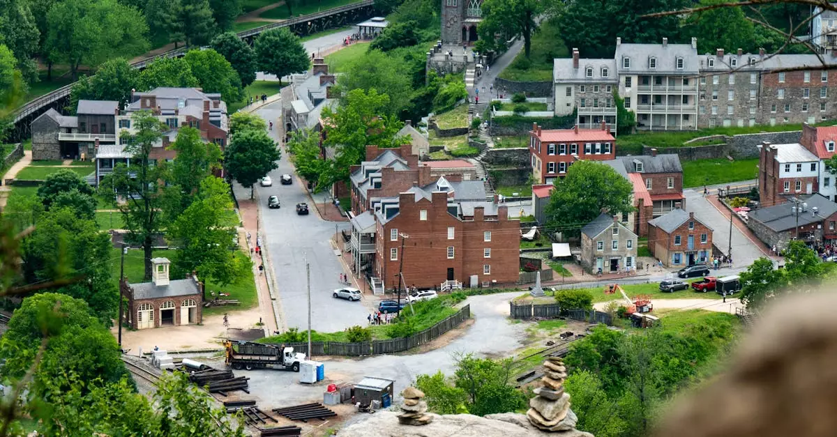 Aerial view of Harpers Ferry, showcasing historic buildings surrounded by lush greenery.