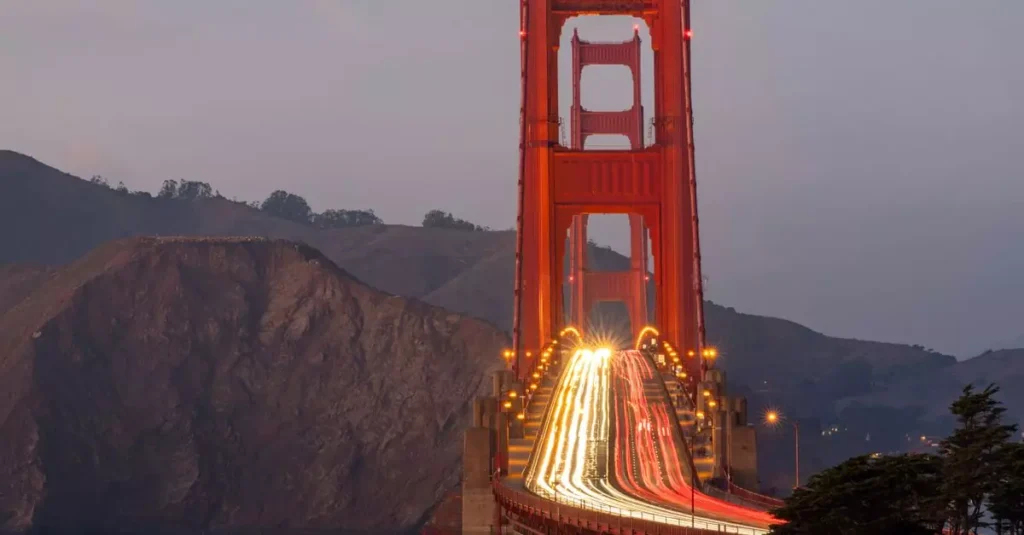Best Travel Wellness Tips for a USA Getaway 8 Captivating view of the Golden Gate Bridge with stunning light trails captured at dusk.