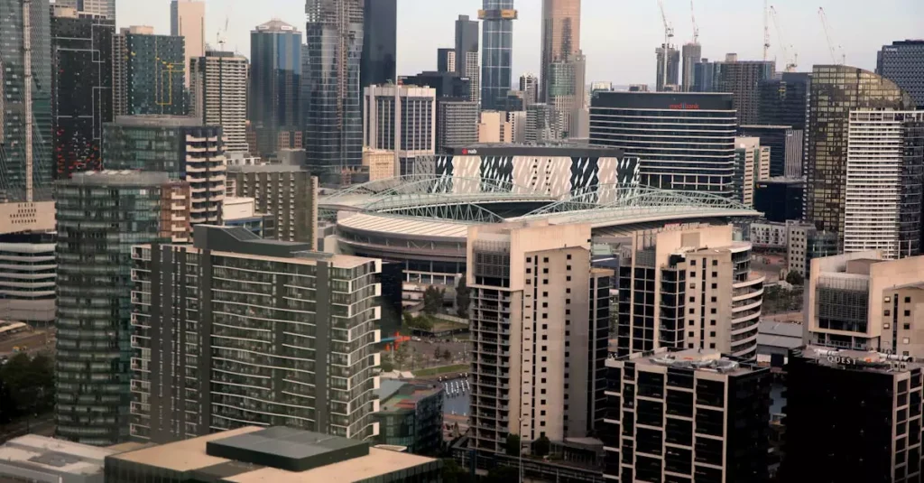 Best Underrated Australian Cities: Hidden Gems Guide 9 Aerial view showcasing Docklands, Melbourne skyline with high-rise buildings and iconic architecture.