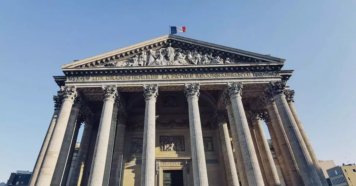 Low angle shot of the iconic Panth&eacute;on in Paris with a clear blue sky.